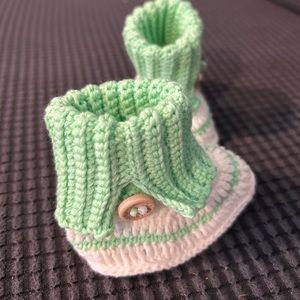 Beautiful hand knitted little boots